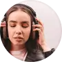 anna kim wearing headphones with closed eyes